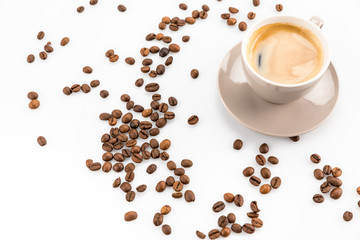 coffee beans and cup of hot coffee isolated on white