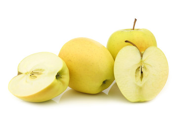 Naklejka na ściany i meble fresh yellow apples and a cut one on a white background
