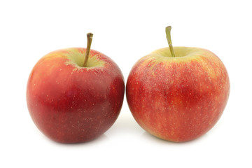 Fototapeta na wymiar two fresh red and yellow apples on a white background