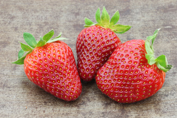 fresh strawberries on a metal tray background