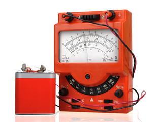 Analog vintage multimeter with battery isolated on white