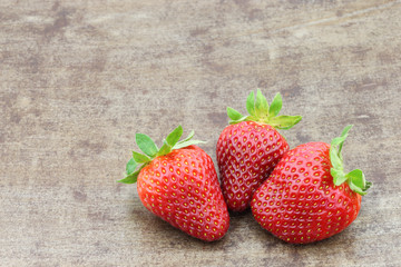 fresh strawberries on a metal tray background