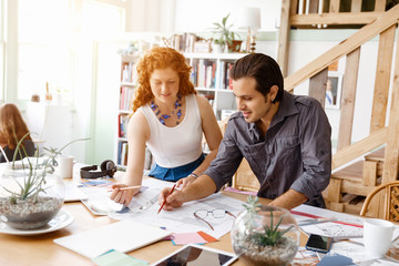 Two young architects in office