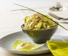 Raw collard greens salad served with mayonnaise.