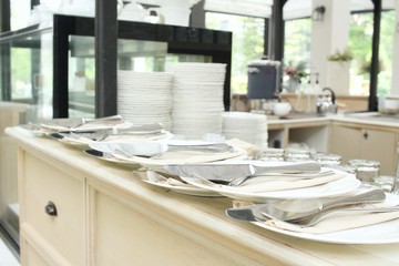 Empty dish with spoon and knife at restaurant