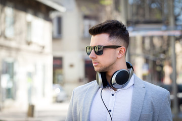 young businessman listening to music outdoor