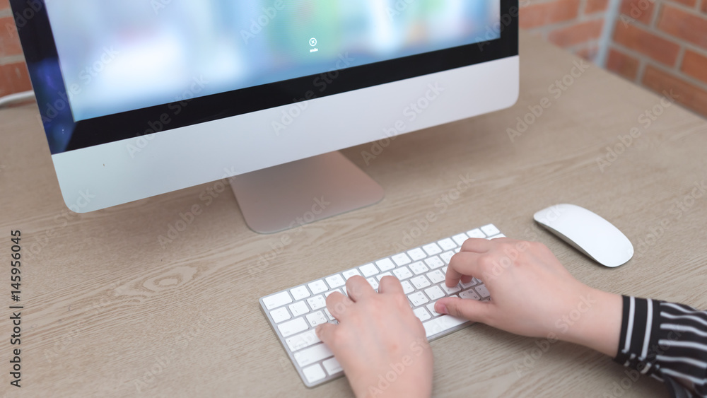 Poster typing on mac keyboard.