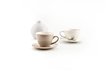 two cups of coffee and vase isolated on white background