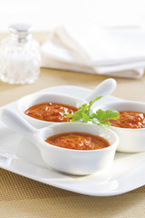 Three bowls of homemade tomato sauce.