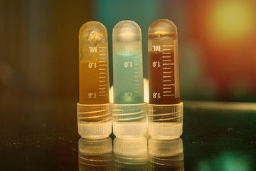 Colorful Vials cancer gene DNA research, cancer early detection