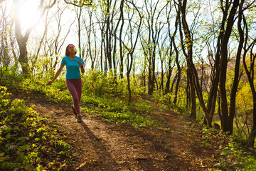 Fototapeta premium Girl running in the woods..