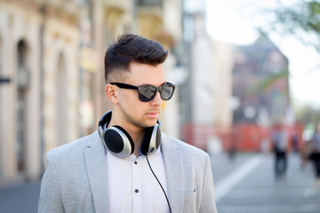 young businessman listening to music outdoor