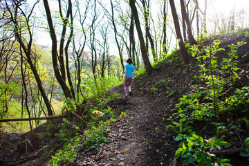 Girl running in the woods..