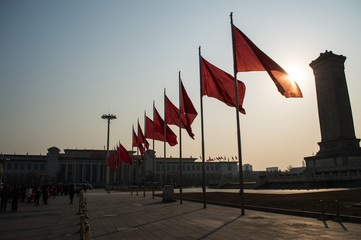 Chinese Flags Swaying in the Morning Breeze with Sunshine at Tiananmen Square, Beijing, China