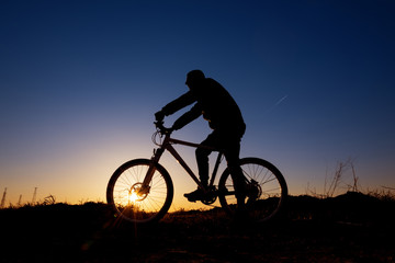 Fototapeta na wymiar Dreamy sunset and healthy life.Fields and bicycle