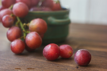 Fresh grapes on wooden table