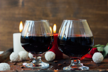 Romantic dinner drink - wine or brendy in glass.
