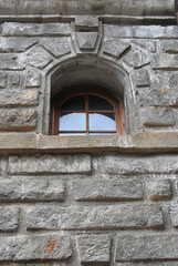 Fototapeta na wymiar Wooden frame window on brick wall