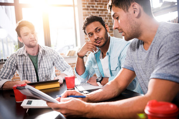 Fototapeta premium Young professional group working on new business project