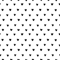 Hand drawn doodle small black ink hearts on white background. Seamless pattern. Vector illustration.