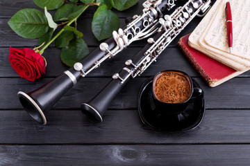 Musical background, poster - oboe, clarinet, rose, coffee, notes, symphony orchestra. Musical still...