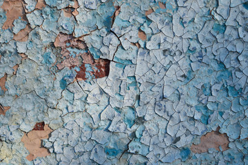 Cracked blue wall.
