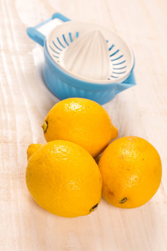 Fresh yellow lemons with plastic strainer