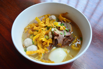 Spicy egg noodle soup with egg and red roast pork