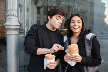 Brother trying to eat burger