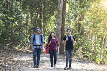 young asian hipster walk to jungle for natural tour.