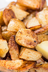 Macro closeup fried young potatoes with blurred background