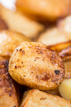 Macro closeup fried young potatoes with blurred background