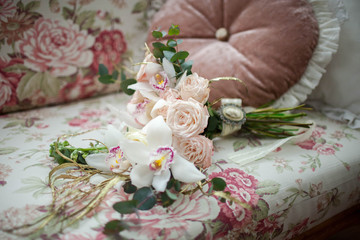 a beautiful bouquet of roses lying on the sofa