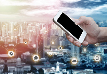 Man's hand shows mobile smartphone in vertical position