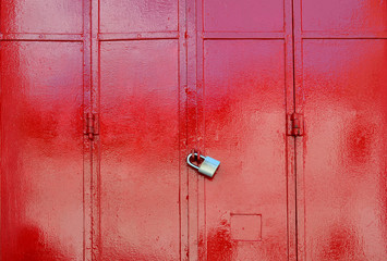 Red metal sheet door was locked with padlock
