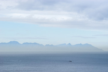 Clouds over the mountains and the sea near Cape of Good Hope, South Africa.