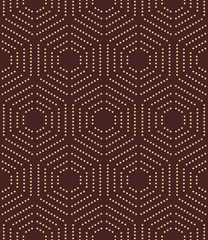 Geometric repeating ornament with hexagonal dotted golden elements. Seamless abstract modern pattern
