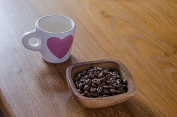 roasted coffee beans in wooden bow