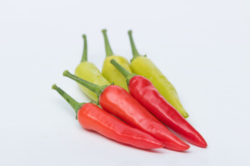 Close up green and red chili pepper on white background isolated.