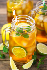Ice tea with lemon, lime and mint 