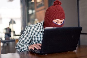 electronic crime concept. hacker is using computer.