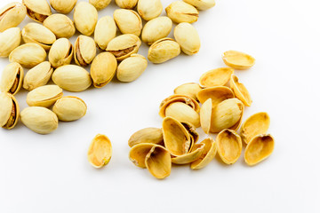 Isolated roasted pistachios nuts on a white background