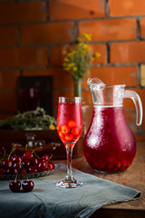 Cold and fresh Cherry juice on wooden table Rustic style