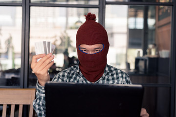 electronic crime concept. hacker is using computer.