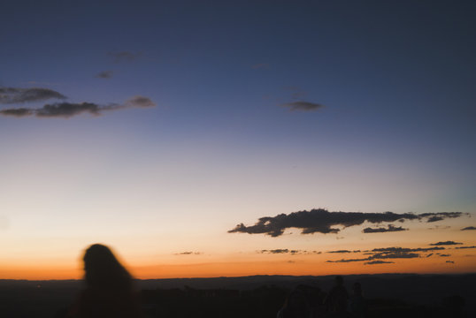 Girl silhouette at sunset in Brazil