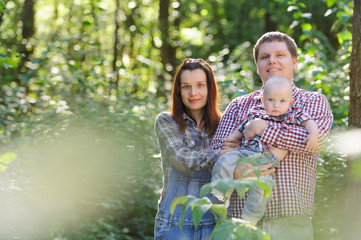 Family spending time in the forest in the summer