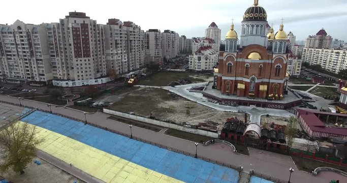 Obolon buildings, orthodox church, aerial footage. Cityscape of Kiev, Ukraine.