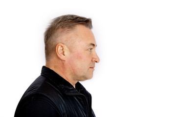 Fototapeta premium Portrait of a gray-haired man in profile