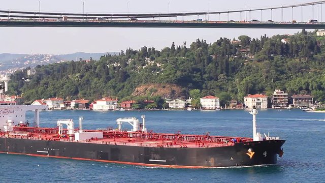 Super tanker full of oil sailing along the Bosporus. Crude oil tanker ship.  A 274 mt long, 48 mt width vessel, has a deadweight of 150,581 tons. 