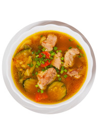 Meat soup with vegetables. top view. isolated on white